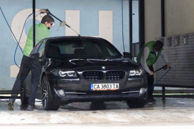 man washing a car